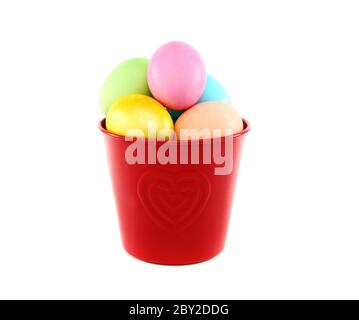 Colorful Easter eggs in a red bucket. Stock Photo