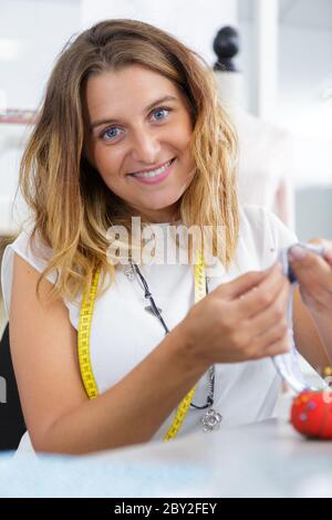 young woman doing needlework in a workshop Stock Photo