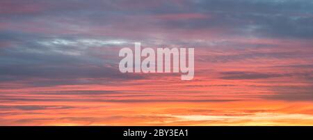 Multi colored textured sky during sunset. Suitable as background or wallpaper. Stock Photo