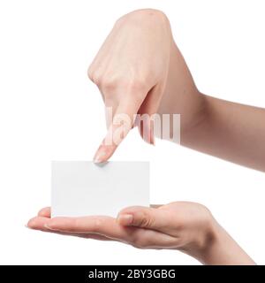 Woman hand holding empty visiting card and pointing on it isolated on white Stock Photo