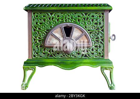 Old indoor wood burner with a decorative pattern scratches and dents from use on an isolated white background with a clipping path Stock Photo