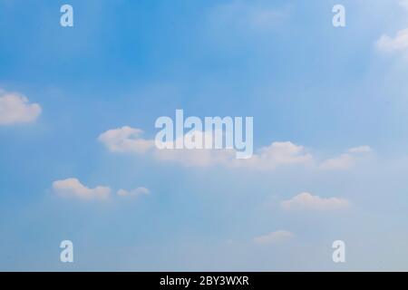 Beautiful fluffy white clouds with blue sky and Sunlight, Nature background. Stock Photo