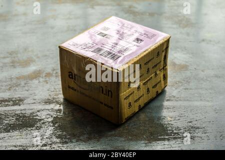 Close-up Amazon Prime package box unpacked after delivery on Amazon Prime Day. Amazon Logo printed on Amazon delivery box. Kolkata India South Asia Pa Stock Photo