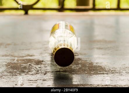 Glass bottle Lying on rustic floor. Still Life. Selective focus. Shallow depth of field.99999999999999999999999999999999999999999999999999999999999999 Stock Photo