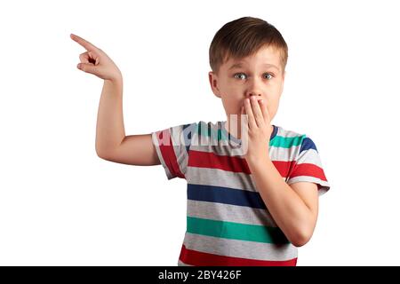 Cute little kid pointing with his finger on something, isolated on white background. Stock Photo