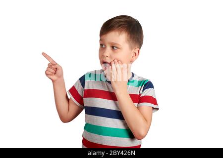 Cute little kid pointing with his finger on something, isolated on white background. Stock Photo