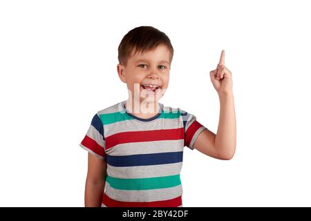 Cute kid pointing with his finger on something, isolated on white background. Stock Photo