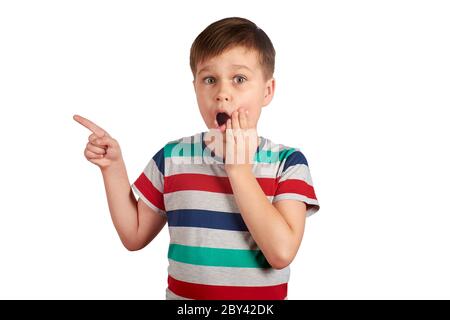 Cute kid pointing with his finger on something, isolated on white background. Stock Photo