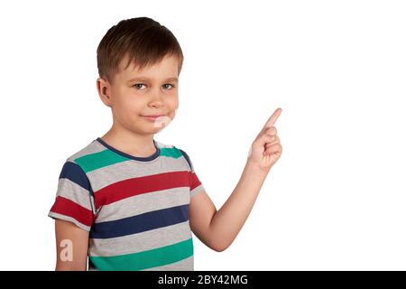 Cute kid pointing with his finger on something, isolated on white background. Stock Photo