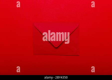 Opened red envelope. Blank envelope on dark red background. Stock Photo