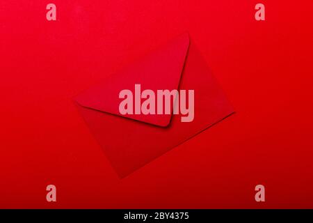 Opened red envelope. Blank envelope on dark red background. Stock Photo
