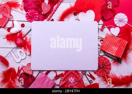 Wooden white background with red hearts and gifts. The concept of Valentine Day whith empty blank for text. Top view copy space. Stock Photo