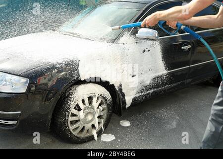 A man washes a car. Clear car concept Stock Photo
