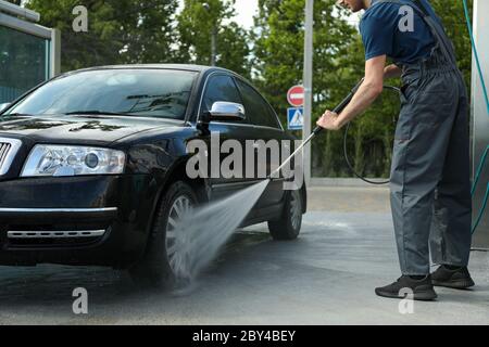 A man washes a car. Clear car concept Stock Photo