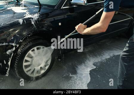 A man washes a car. Clear car concept Stock Photo