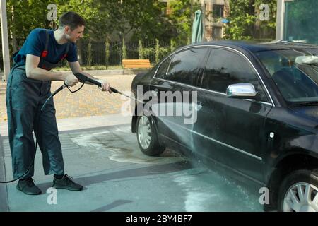 A man washes a car. Clear car concept Stock Photo