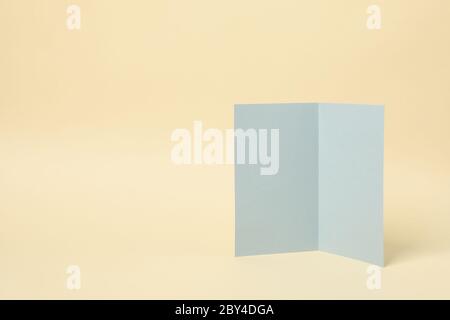 Light gray cardboard on beige background, space for text Stock Photo