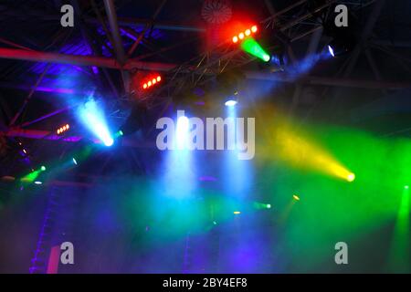colored spotlights on ceiling in smoke Stock Photo