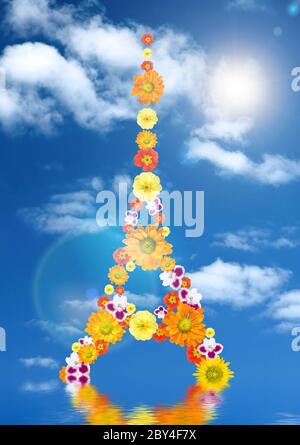 eiffel tower from flowers with reflection and sun against blue sky Stock Photo