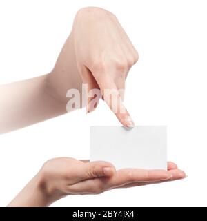 Womans hands holding and pointing empty visiting card isolated on white Stock Photo