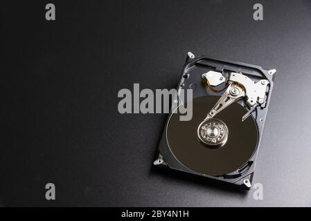 Opened hard drive from the computer hdd with mirror effects. Part of computer pc, laptop Stock Photo