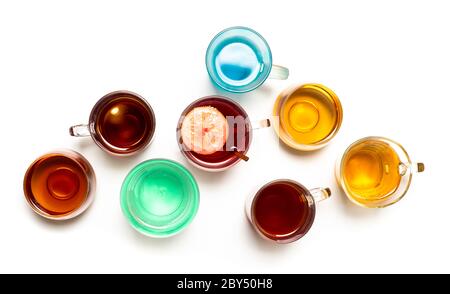 Various colorful herbal tea collection in glass cups on white background isolated Stock Photo