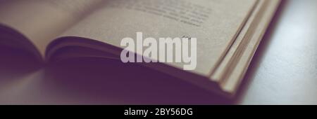 Open book on the table. Side view, closeup. Page 129. Stock Photo