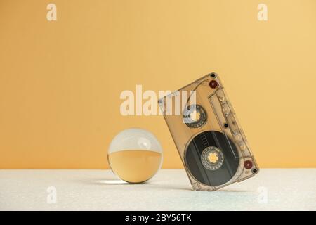 Close up Audio cassette tape on a white table and yellow space.Minimalism retro style concept. 80s. Background pattern for design. Stock Photo