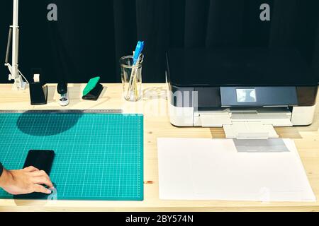 Vision of a desk with its printer and a mobile phone Stock Photo