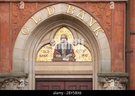 The HSBC bank on the corner of Chapel Street and Ely Street in the centre of Stratford upon Avon. The bank has a gilt sign depicting Shakespeare above it's entrance and dates back to 1810. The bank is known as the old bank. Stock Photo