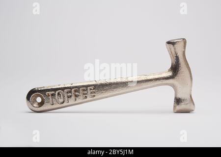 Photograph of a 1950's Bluebird toffee hammer on white background. Stock Photo