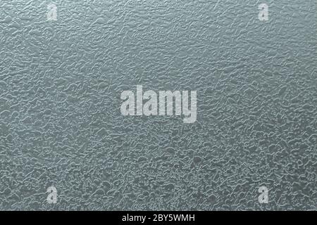 Embossed relief on the metal surface. For use as an abstract background. Stock Photo