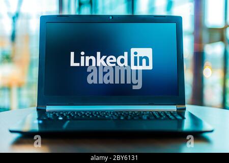 POZNAN, POL - MAR 24, 2020:: Laptop computer displaying logo of LinkedIn, an American business and employment-oriented service that operates via websi Stock Photo
