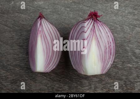 Studio Shot of Two Quarter Cut Red Onion on Wooden Background From Series With Different Shape Stock Photo