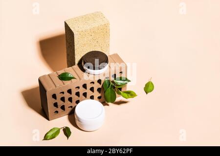 Isometric view of trendy composition made of bricks and Natural cosmetic products in earthy colors. Stock Photo