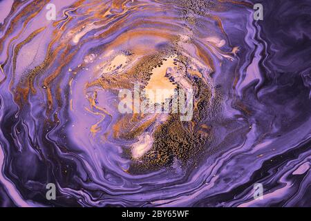Acrylic Fluid Art. Violet vortex waves and gold particles. Abstract swirling background or texture. Stock Photo