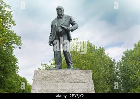 Winston Churchill Bronze Statue on plinth in Woodford Green, photo looking up from plinth. Essex, England Stock Photo