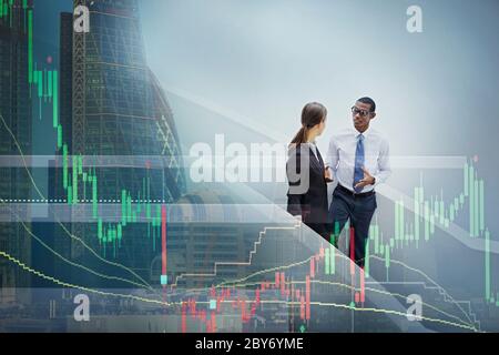 Graph over business people and highrise buildings Stock Photo