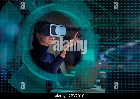 Businesswoman using virtual reality glasses Stock Photo