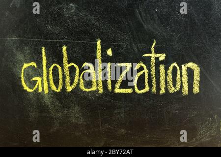 business globalization written on blackboard Stock Photo