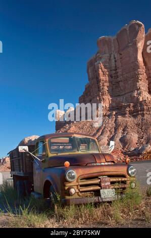 Old rusted Dodge at Twin Rocks Trading Post cafe in Bluff, Utah, USA Stock Photo