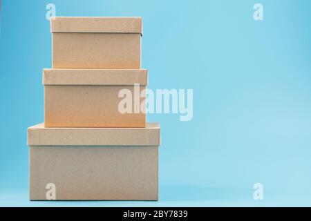Cardboard boxes on a blue background, free space. isolate Stock Photo