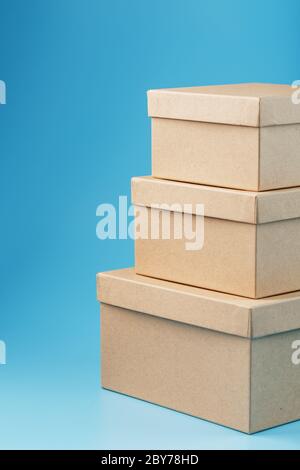 Cardboard boxes on a blue background, free space. isolate Stock Photo