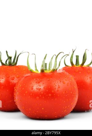 Three red tomatos isolated on white background Stock Photo - Alamy