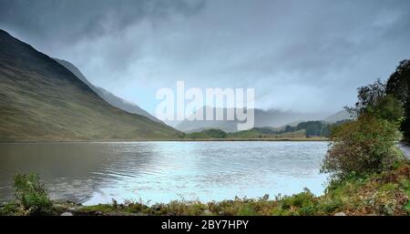 In drizzle and overcast skies and to the sound of rutting stags in the hills, view across Loch Beannacharain from the road to Scardroy. 25/09/19 Stock Photo