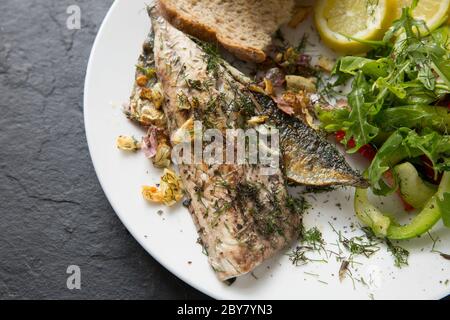 Two mackerel fillets from a mackerel, Scomber scombrus, that was caught on rod and line from Chesil beach in Dorset. The fillets have been fried with Stock Photo