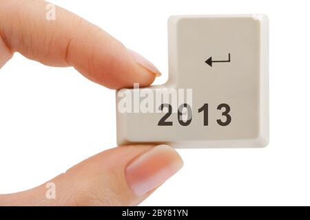 Computer button 2013 in hand Stock Photo