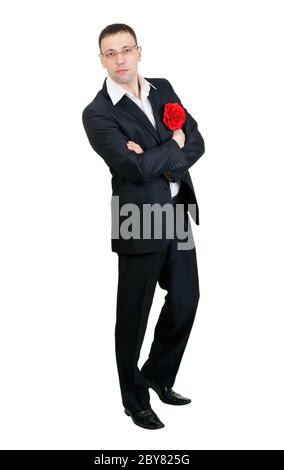 A man with a tango dancer in red fabric flower in his jacket pocket Stock Photo