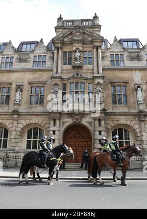 Police on horseback in front of Oriel College, Oxford ahead of a protest calling for the removal of the statue of 19th century imperialist, politician Cecil Rhodes from the Oxford college which has reignited amid anti-racism demonstrations. Stock Photo