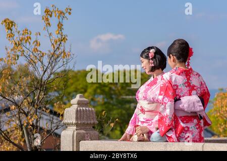Kyoto / Japan - November 3, 2017: Pretty Japanese girls dressed in traditional kimonos, taking selfies at Kiyomizu-dera temple in Kyoto, Japan Stock Photo